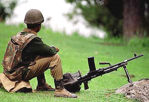 A paramilitary jawan keeps a watch in Pahalgam on Sunday