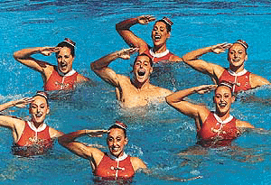 Bill May (C) from Santa Clara, California, performs along with other members of the U.S. National Synchro Swimming team during the technical routine at the Rome Synchro Open on Saturday. Although May is a national team member, he can not compete for the USA in Sydney since the International Swimming Federation FINA defines the sport as "women's synchronized swimming"