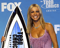 Singer Britney Spears poses with one of her Teen Choice Awards following the awards show in Santa Monica on Monday. Spears won for Choice Female Artist-Music and also for Female Hottie of the year