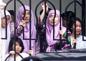 Wan Azizah Wan Ismail ( second from right ), wife of jailed Malaysia�s former Deputy Prime Minister Anwar Ibrahim, looks on with her children at courthouse in Kuala Lumpur, on Tuesday