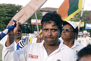 Former Sri Lankan captain Arjuna Ranatunga walks back to the pavilion on the last day of their third and final cricket test on Thursday. Ranatunga, 36, is to retire from international cricket after the test, ending an illustrious 18-year career during which he became Sri Lanka's most successful captain and their second highest run-getter