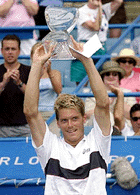 Thomas Enqvist, from Sweden, holds the championship trophy after defeating Tim Henman, from Great Britain, 7-6, 6-4, to win the Tennis Masters Series Cincinnati tournament, on Sunday, in Mason, Ohio.