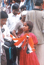 A girl selling Tricolor prior to Independence Day in Bhopal on Monday
