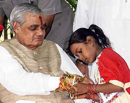 A girl tieing the rakhi to Prime Minister A.B. Vajpayee on the occasion of Raksha Bandhan in New Delhi on Tuesday