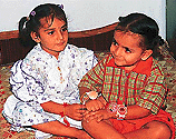 Strengthening the bonds of love: A little girl ties a rakhi on her brother's wrist in Chandigarh on Tuesday. � A Tribune photograph