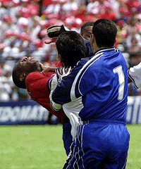 Costa Rica's star player Paulo Wanchope (left) is grabbed by the throat by Guatemalan Gustavo Cabrera in a discussion during their World Cup qualifying match in Alejando Morena stadium in Alejuela, Costa Rica, 19 miles west of San Jose, on Tuesday