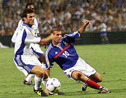 France's Zinedine Zidane, (right) and Fifa World Stars' Ciro Ferrara of Italy challenge for the ball during their friendly soccer match on Wednesday, in Marseilles, southern France, for the benefit of SOS Children's Villages, Fifa's adopted charity.