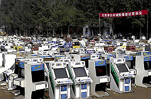    BEIJING : About 1500 confiscated gambling machines and 1200 integrated circuit boards are waiting to be destroyed by bulldozers in Beijing, Wednesday, Aug. 16, 2000. The machines were confiscated during recent raids on illegal game rooms throughout Beijing. AP/PTI