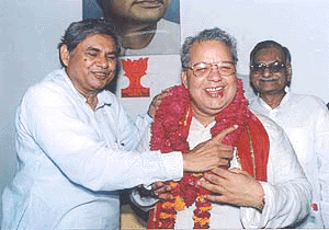 The newly elected president of BJP's Uttar Pradesh unit, Kalraj Misra being congratulated by outgoing acting president, Om Prakash Singh in Lucknow on Thursday