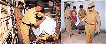 Grisly end: A cop covers the body of one of the deceased with a sheet; (right) policemen bring out the body of another deceased, which was dumped in the bathroom of the liquor vend in Sector 24 of Chandigarh on Thursday.  Tribune photos by Manoj Mahajan
