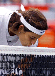 Spain's Arantxa Sanchez-Vicario kisses the net after the ball hit the top and fell over for a point during her third round 6-4, 7-5 victory over Jennifer Capriati at the du Maurier Open tennis tournament on  Thursday,  in Montreal
