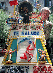 Javier Soto stands behind his scooter adorned with items for Mexico and the Olympics on  Thursday, in downtown Mexico City. Every four years since 1968, Soto has decorated his ride to cheer on Mexican athletes competing in the Olympics