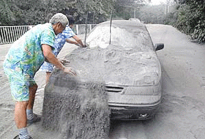 A couple removes volcanic ash off their car on Saturday as residents of Miyakejima island, 190 kilometers (120 miles) south of Tokyo, began return home after they were forced to seek shelter Friday from volcanic eruption of Mount Oyama on the island, spewing ash as high as 8,000 meters (26,400 foot) into the air. Friday's eruption was the largest by Oyama since the volcano awoke last month from a 17-year slumber