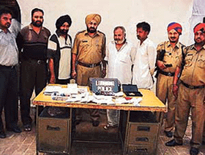 CIA staff personnel with the two accused in the fake licence racket