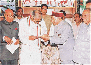 The CLP Leader Mr Virbhadra Singh, Presenting the "Chargesheet " against the BJP-HVC Combine Government to the Governor, Mr Vishnu Kant Shastri, At Shimla on Saturday. Also seen in the picture is Mr Sat Mahajan, PCC Chief