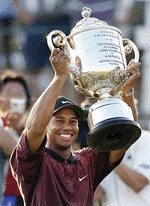   LOUISVILLE, USA : Tiger Woods holds up the Wanamaker Trophy after winning the PGA Championship over Bob May in a three-hole playoff on Sunday, on Sunday, at the Valhalla Golf Club in Louisville. 