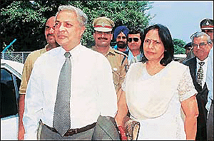 Deposed Prime Minister of Fiji Mahender Chaudhary and his wife arrive at the Chandigarh airport en route to Shimla on Monday.						     � A Tribune photograph