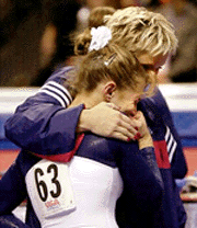 American gymnast Shannon Miller (L) reacts as the decision is made for her to withdraw from the U.S. Olympic Gymnastics Trials in Boston, on Sunday. Miller injured her leg during her first vault and is comforted by coach Shannon Horn