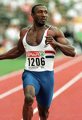 Track legend Linford Christie of Great Britain dashes through the finish line ahead of the pack to win the 100 meters event at the Eurocup track and field finals in Munich's Olympic stadium in this June 21, 1997 file picture