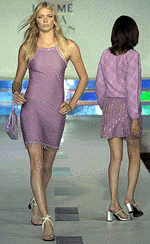 British supermodel Jodie Kidd (L) walks past another model during the presentation of 'Cue,' an ensemble by Indian designers Rohit Gandhi and Rahul Khanna, during a show on the sixth day of the inaugural India Fashion Week on  Tuesday in New Delhi