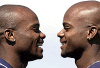 Identical twin brothers Alvin on left and Calvin Harrison of Salinas, before they started training at the new Runnaway Bay atheltics track on the Gold Coast, on Thursday