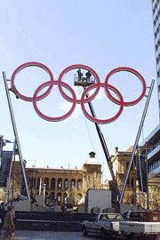 Workmen put the finishing touches to the Sydney 2000 Olympic rings high above Martin Place in the center of Sydney, Australia, on  Friday