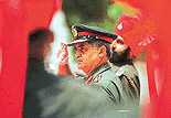Chief of the Indian army General Ved Prakash Malik (C) reviews a ceremonial guard of honour during a farewell function in Calcutta on Tuesday. Malik, who was the Indian military head during the Kargil conflict, will be replaced by incoming Lt. General S. Padmanabhan next month, after the end of Malik's tenure