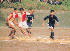 Samuel (left) of Bishop Cotton School, Shimla, tries to get the ball past Lawrence School, Sanawar, defenders in the final of the third Bhupinder Singh Memorial Soccer Tournament-2000 at Sanawar on Wednesday. Samuel scored four goals.