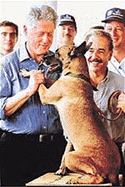 Clintonwith his �darling�: US President Bill Clinton (left) pets a drug-sniffing dog, Darling, while Colombian President Andres Pastrana (centre) watches during a tour of a drug inspection station at Catagena, Colombia, on Wednesday