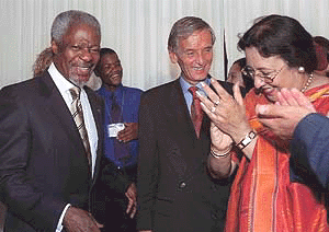 UN Secretary-General Kofi Annan (left) shares a light moment with Mr Raymond Forni (centre), President of the French National Assembly, and Ms Najma Heptullah, President of the Conference of Presiding officers of National Parliaments, during a reception at the United Nations on Thursday
