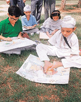 A physically challenged child draws with his feet at a painting competition organised in Patiala