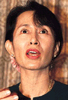 Aung San Suu Kyi escorted home