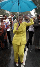 Lady Hillary Rodham Clinton dances in the rain during the West Indian Day Parade on Monday in the Brooklyn borough of New York.