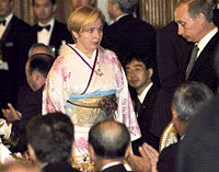 Russia�s First Day Lyudmila �Putin wears a kimono as she accompanies her husband to a  banquet hosted by Japanese Prime Minister Yoshio Mori in Tokyo on Tuesday.