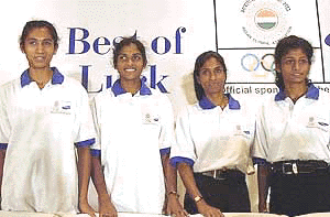 India's 4x400 relay team of Jincy Philip, Manjima Kuriakose, Rosakutty and K.M. Beenamol, pose for photographers at a farewell function in New Delhi on Friday. 