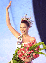 The new Miss Venezuela, Eva Ekall, waves after being crowned during the Miss Venezuela 2000 Beauty Contest in Caracas, Venezuela, on Friday