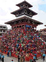 Devotees wait to pay their tribute to Kumari, the Living Godess, who was taken around Katmandu city on a chariot on Tuesday