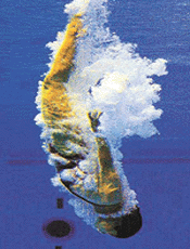 Chinese diver Fu Ming Xia enters the water as she practices from the three-metre springboard at the Olympic Swimming pool at Homebush Bay in Sydney on Tuesday. Fu will compete in the 27th Olympiad when the Sydney 2000 Olympic Games