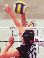 Chinese volleyball team leader Sun Yue spikes the ball as her compatriot Chen Jing attempts to block during a workout in Sydney on Wednesday in preparation for the Sydney Olympic games which begin on September 15