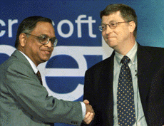 Microsoft Boss Bill Gates shakes hands with Mr N. R. Narayana Murthy of Infosys .