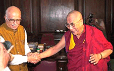 Tibet�s exiled spiritual leader, the Dalai Lama (right), talks to Union Home Minister L. K. Advani in New Delhi on Saturday. 