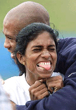 US track star Maurice Green hugs India's Rosa Kutty.