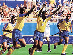 Indian hockey players (from left) Dhanraj Pillay, Sameer Dad, Baljit Singh Dhillon and Riaz Nabi Mohammed rejoice after their 3-0 victory over Argentina in a preliminary hockey match of the Olympic Games in Sydney on Sunday.