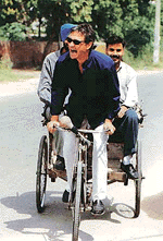 French dentist Gilles Martin tries his hand at a cycle-rickshaw in Ludhiana on Wednesday.