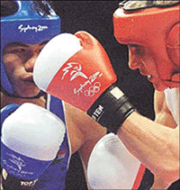 India's Dingko Ngangom Singh (L) fights Ukraine's Serguey Daniltchenko in their 54 kg boxing bout at the Sydney Olympic Games on Thursday. Daniltchenko won the bout on points. � Reuters  Photo