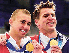 Gary Hall Jr. (right) and Anthony Ervin of the USA after finishing the 50m freestyle final in an exact tie for first place at the Sydney 2000 Olympic Games on Friday.