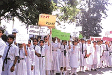 Students of various schools display placards with slogans at an anti-addiction march organised by Guru Gobind Singh Study Circle in Ludhiana