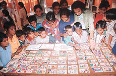 �Proud painters�: slum children of Janata Colony show their works to students of Government Arts College in the Art Gallery in Chandigarh on Monday. Tribune photo by Manoj Mahajan