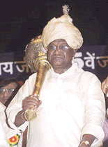 BJP president Bangaru Laxman brandishing mace (gada) at his felicitation function in New Delhi on Monday