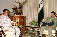 Iraqi President Saddam Hussein receives India's Minister of State for External Affairs Ajit Kumar Panja